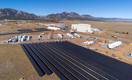 aries-73089-block Aerial view of Flatirons campus with solar panels and storage facility