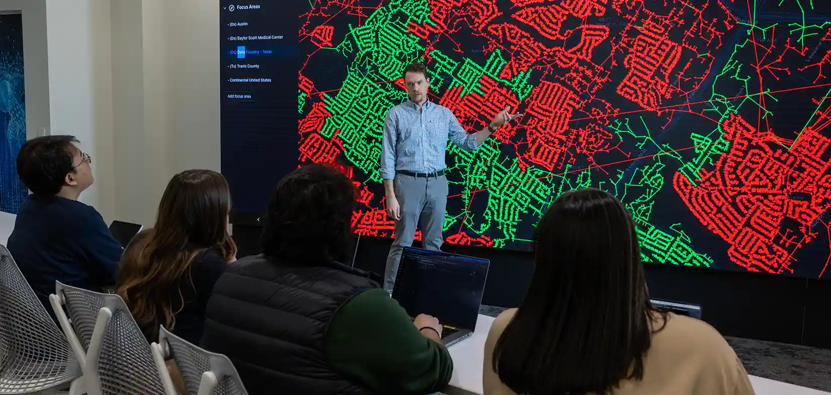 Researcher presents cybersecurity grid data to group of people
