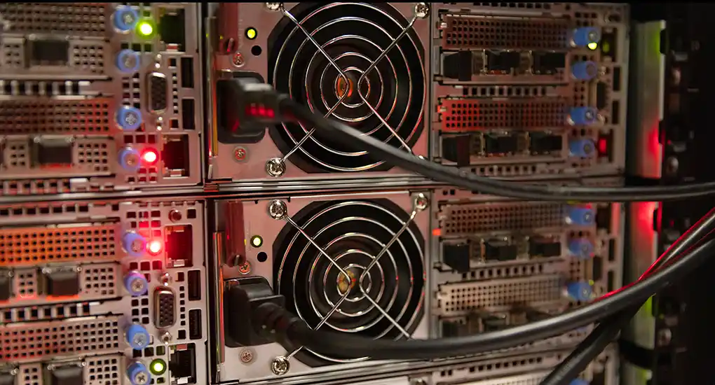 A closeup view of electrical equipment with lights, fans, and cords.