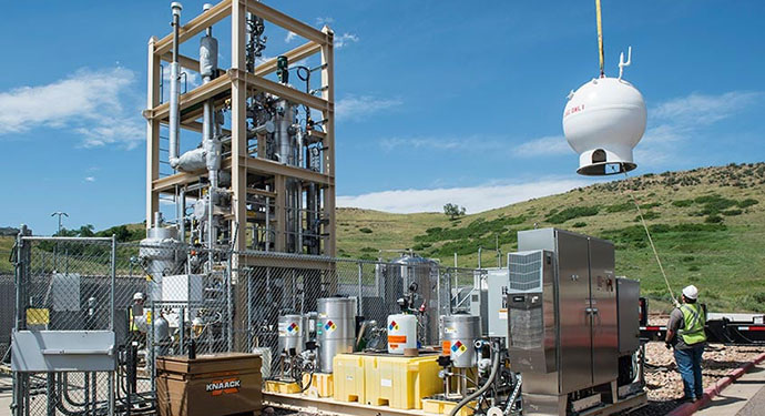 amo-57497-small Crews crane a natural gas storage vessel into place in a bioreactor.