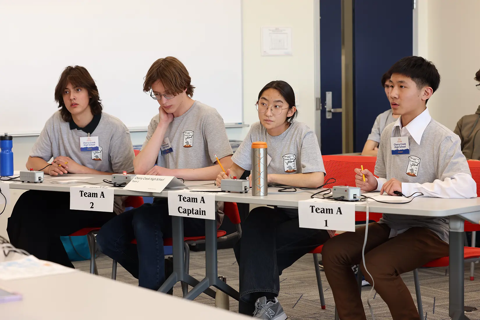 20260324-high-school-science-bowl-cherry-creek-AI3A4308 A row of students seated at tables during a science competition