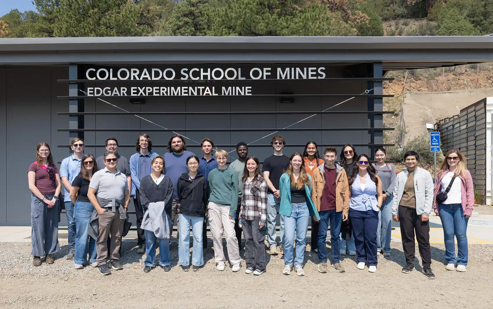 20260817-unearthing-the-future-inside-nlr-summer-educational-programs-106525 Twenty-two people standing outside a building with the text Colorado School of Mines Edgar Experimental Mine
