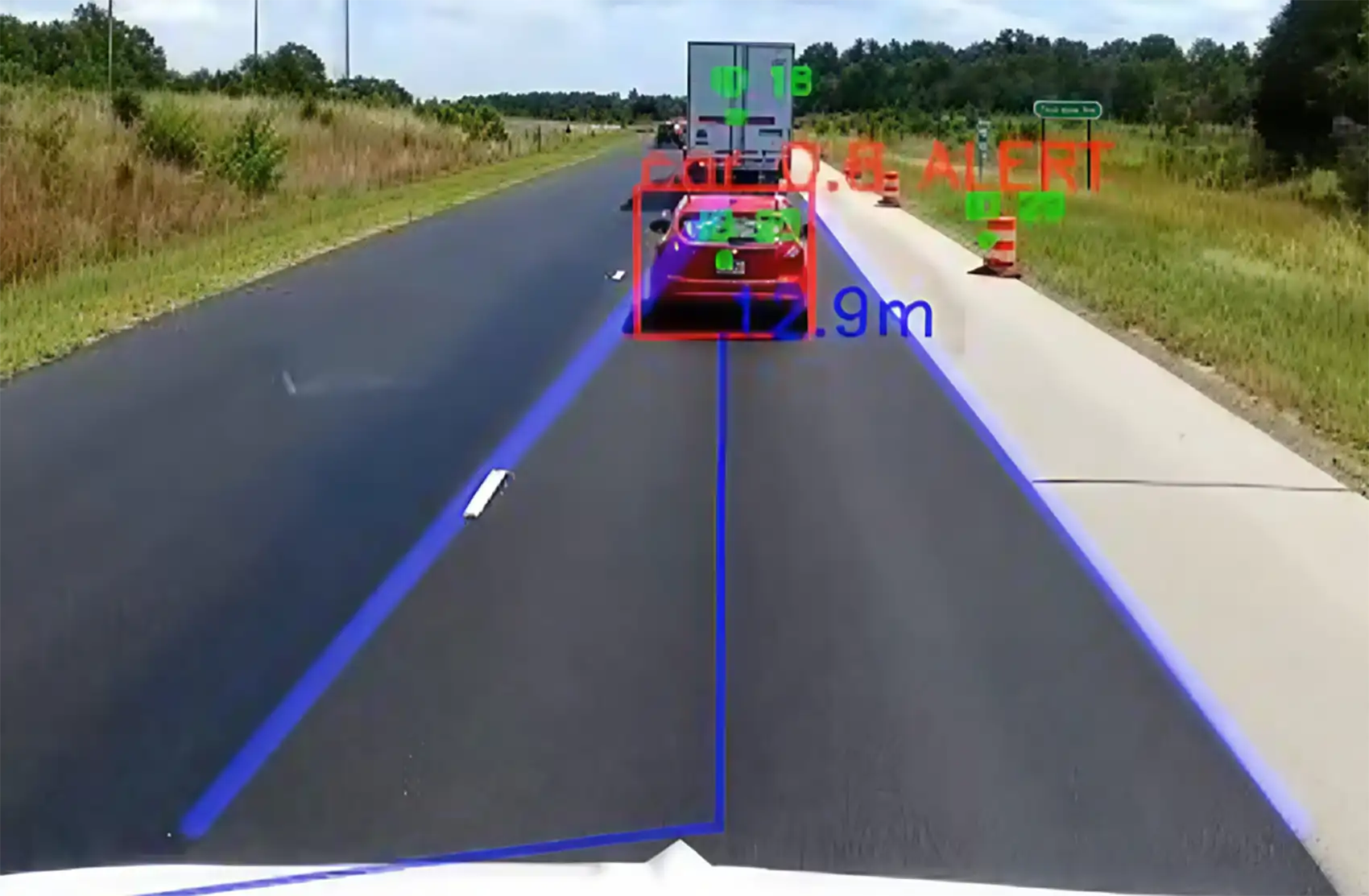 20261021-super-intelligence-speeds-up-transportation-research-at-national-laboratory-of-the-rockies-cummins-computer-vision Dashboard camera footage highlights a small red car tailgating a truck by putting a digitally-produced red square around it.