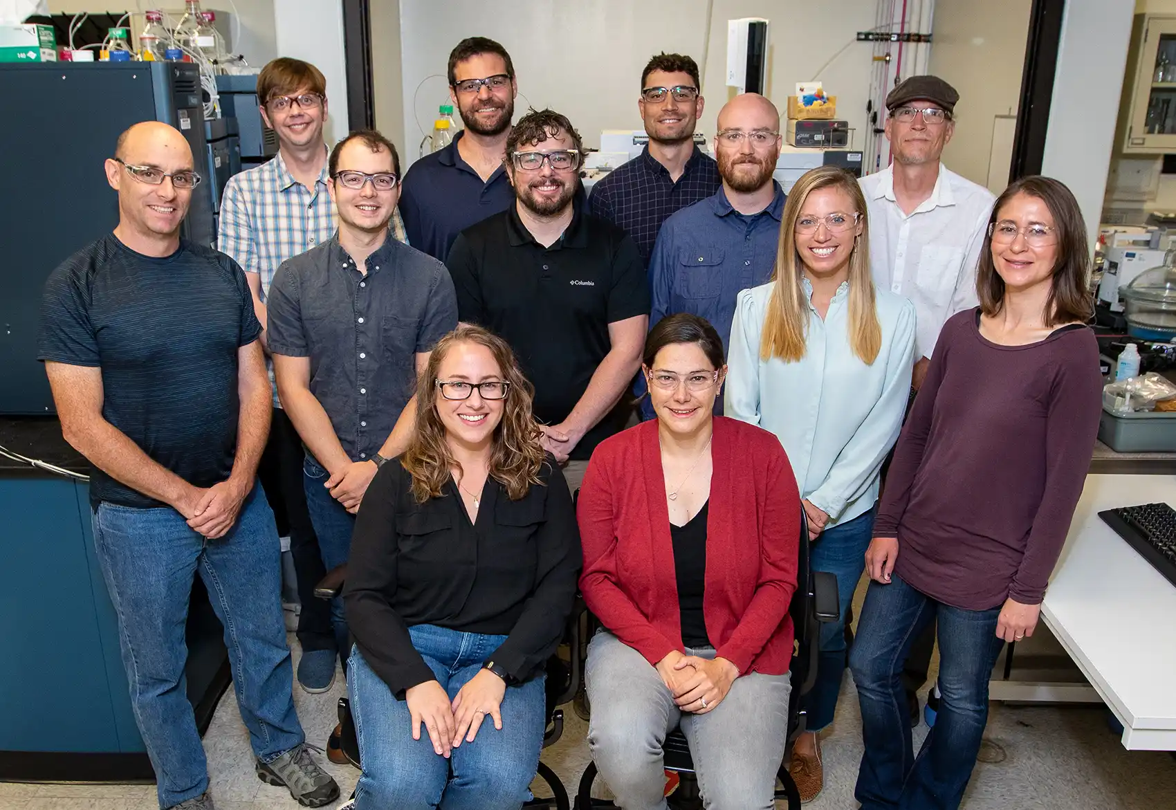 20251202-turning-plastic-waste-into-opportunity-ongoing-projects-demonstrate-broad-applications-of-chemical-oxidation-recycling-platform-71992 A group of researchers pose in a lab.