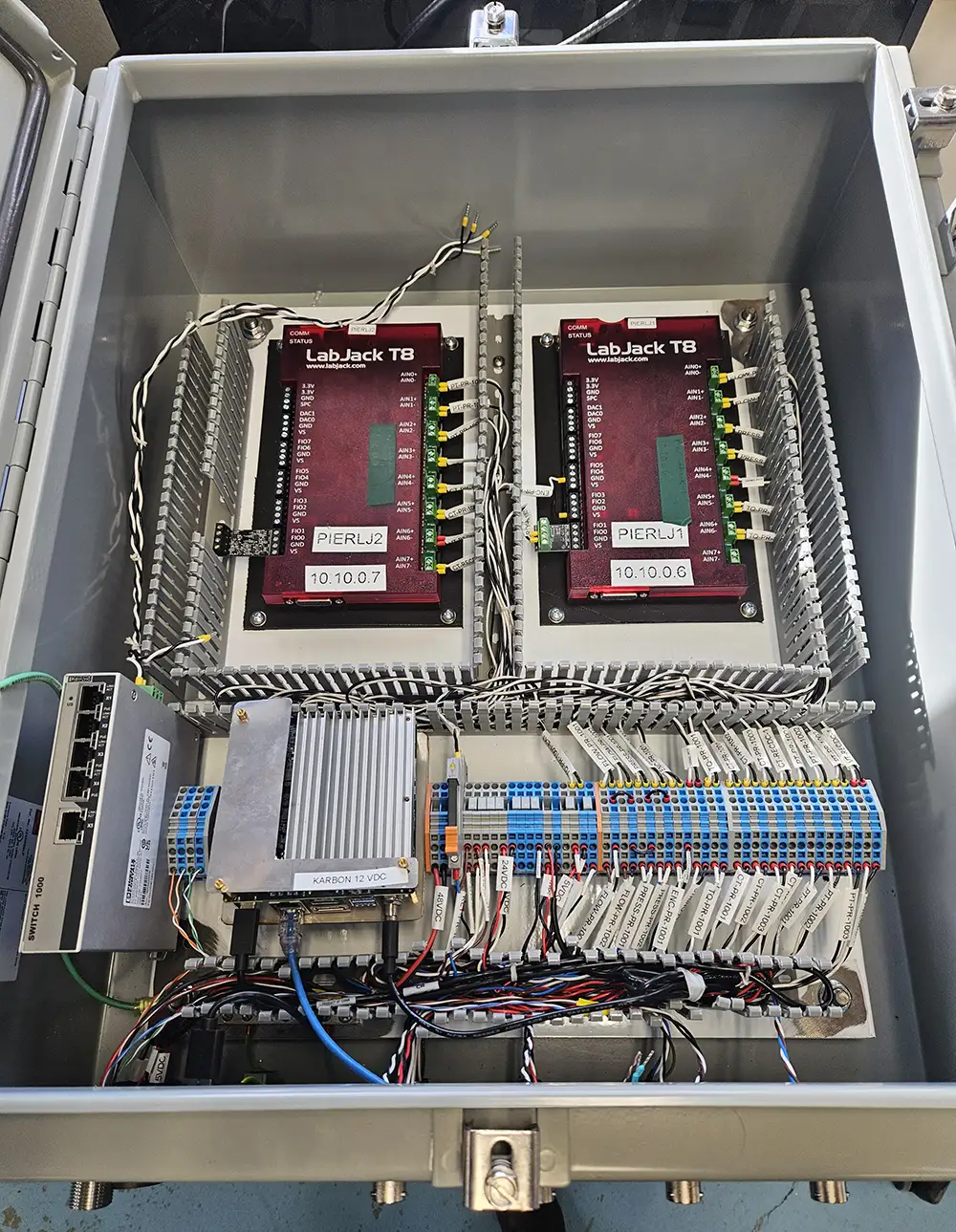 20260209-how-to-crack-the-wave-energy-code-modaq A metal box containing wires and hardware.