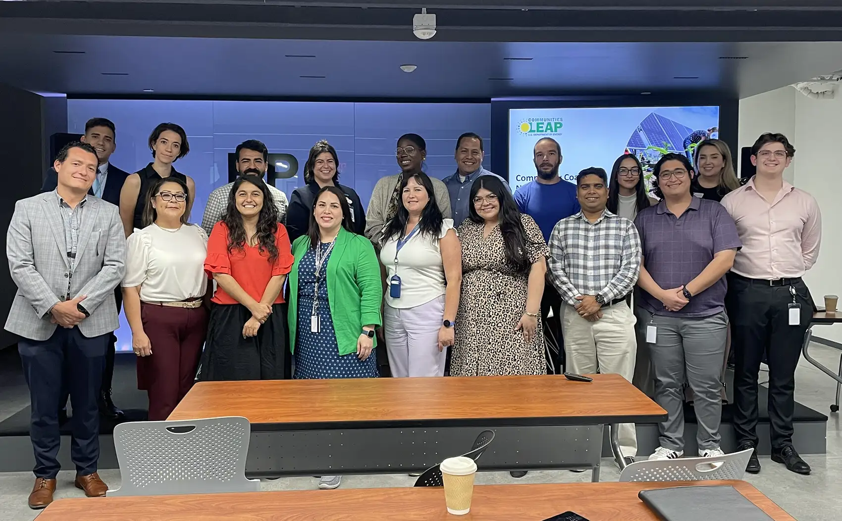20260224-beneath-the-surface-glorynel-ojeda-matos-on-strengthening-the-systems-we-depend-on-el-paso Two rows of people standing and smiling for a group photo.