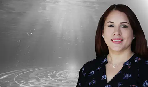 Continue reading about eadshot of Glorynel Ojeda Matos overlaid on a black-and-white underwater graphic.