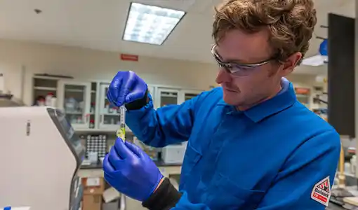 Continue reading about A National Laboratory of the Rockies bioengineering postdoctoral researcher, Shawn Laursen, prepares a protein sample for purification.