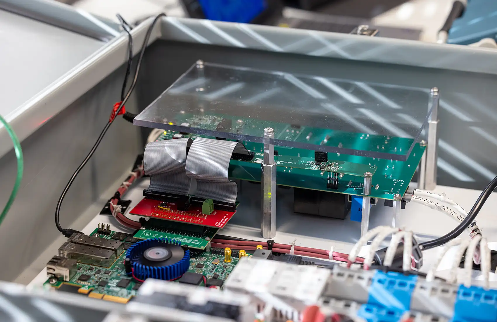 A close-up view inside an open gray metal electronics enclosure.