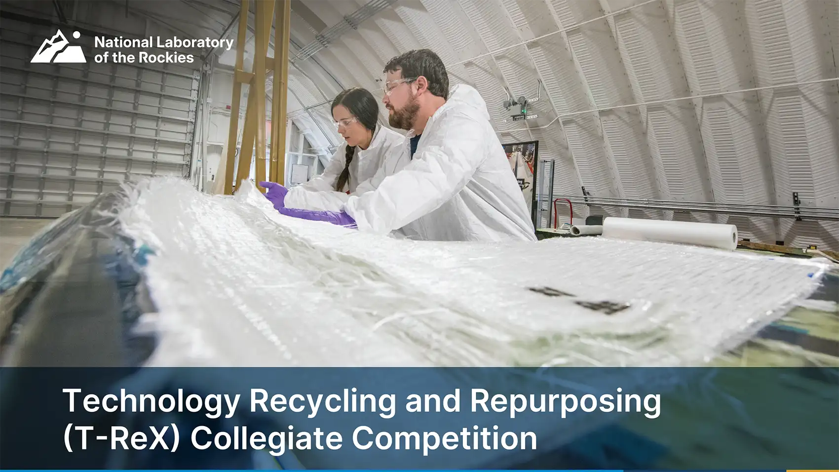 20260729-students-to-help-identify-retirement-options-for-energy-technologies-competition Two people in a large warehouse laboratory with the text Technology Recycling and Repurposing (T-ReX) Collegiate Competition.