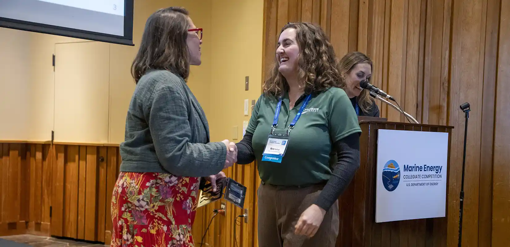 Arielle Cardinal presenting an award to Nora.