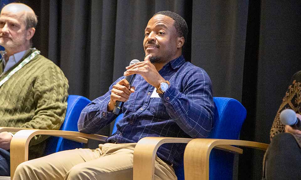 Two men sitting in chairs.