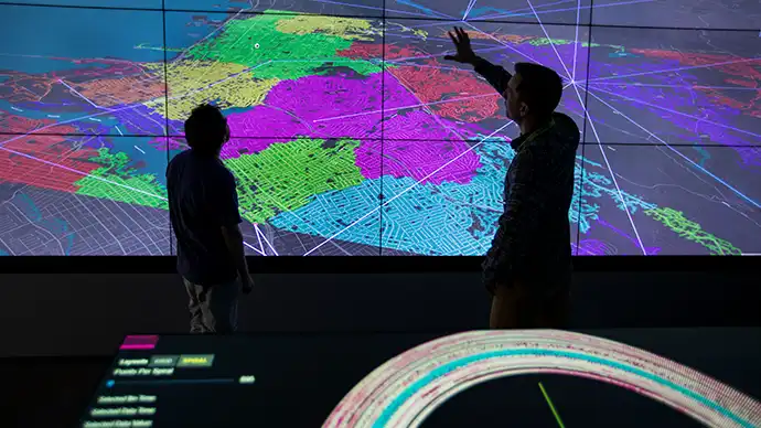 Researchers examine grid data in 2-D Visualization Laboratory.
