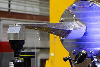 20240731-newsletter-additive-manufacturing 3D-printed stainless steel tidal turbine spar undergoing testing at NREL