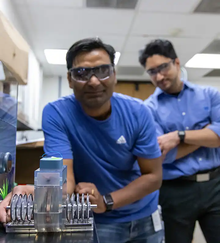 Two researchers test ocean thermal energy prototype