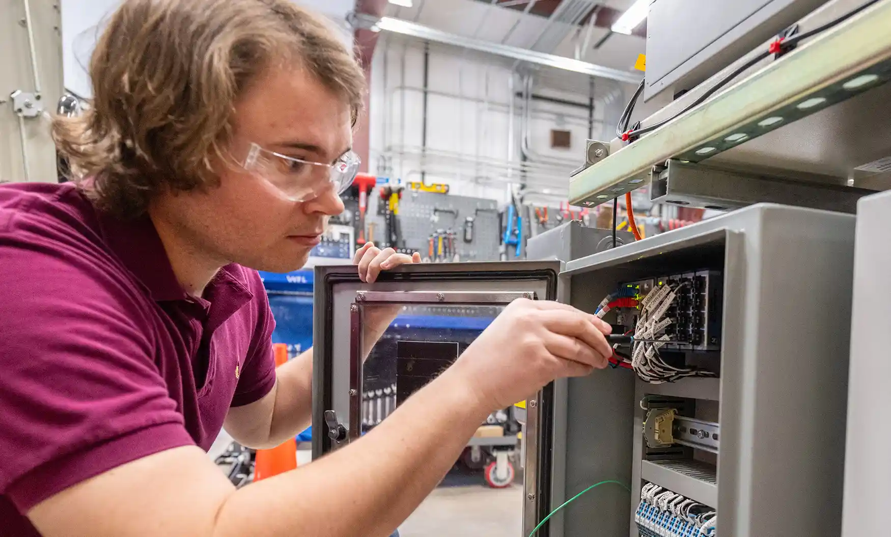 Researcher works on hardware-in-the-loop testing for variable geometry wave energy converters.