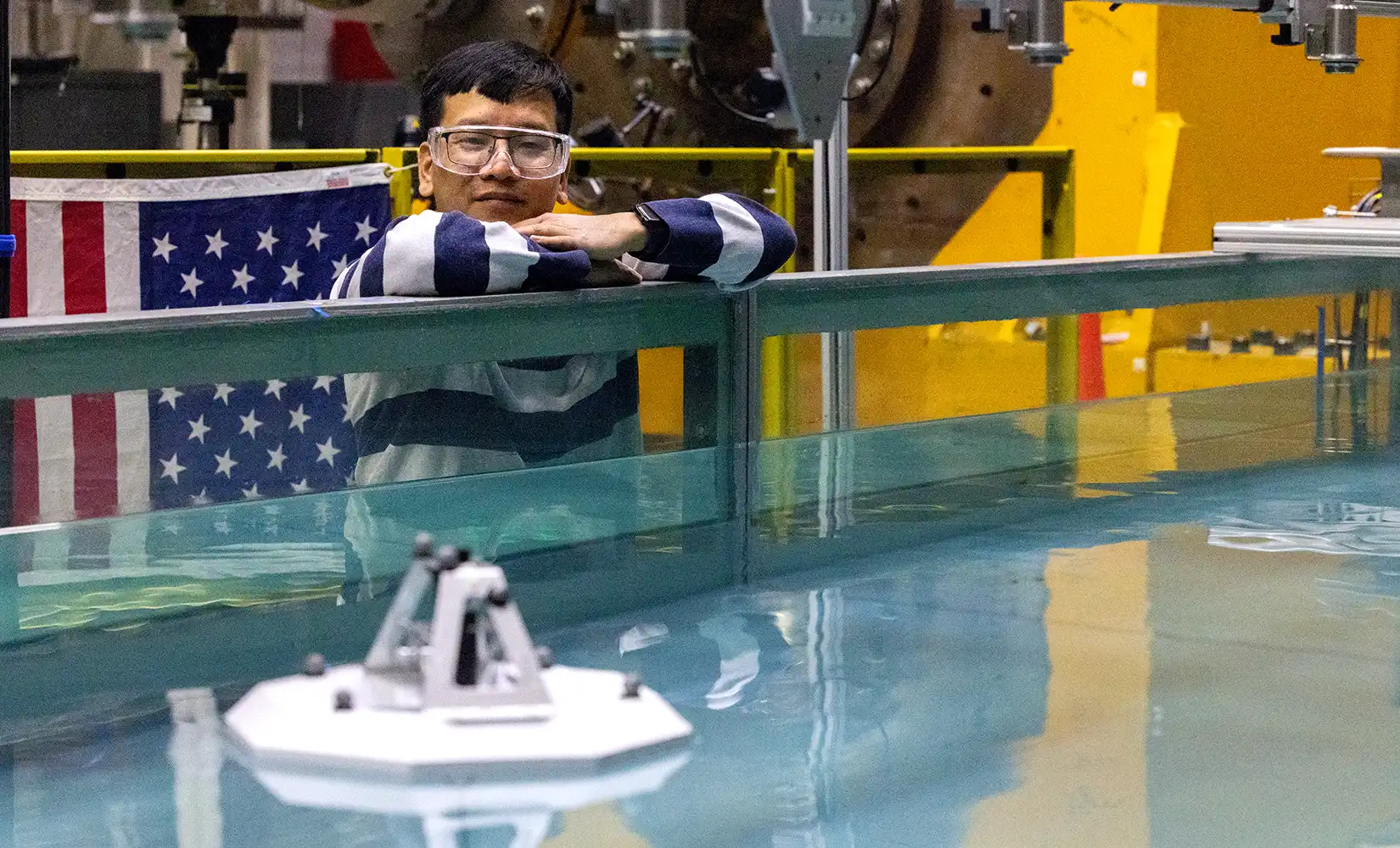 Researcher tests the wave energy device in the wave tank.